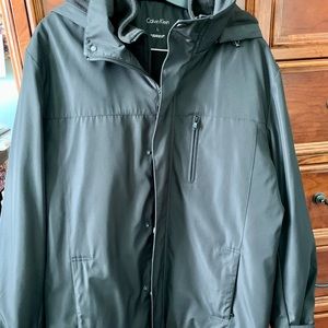 Calvin Klein Men’s heavy winter coat with hood and storage pockets